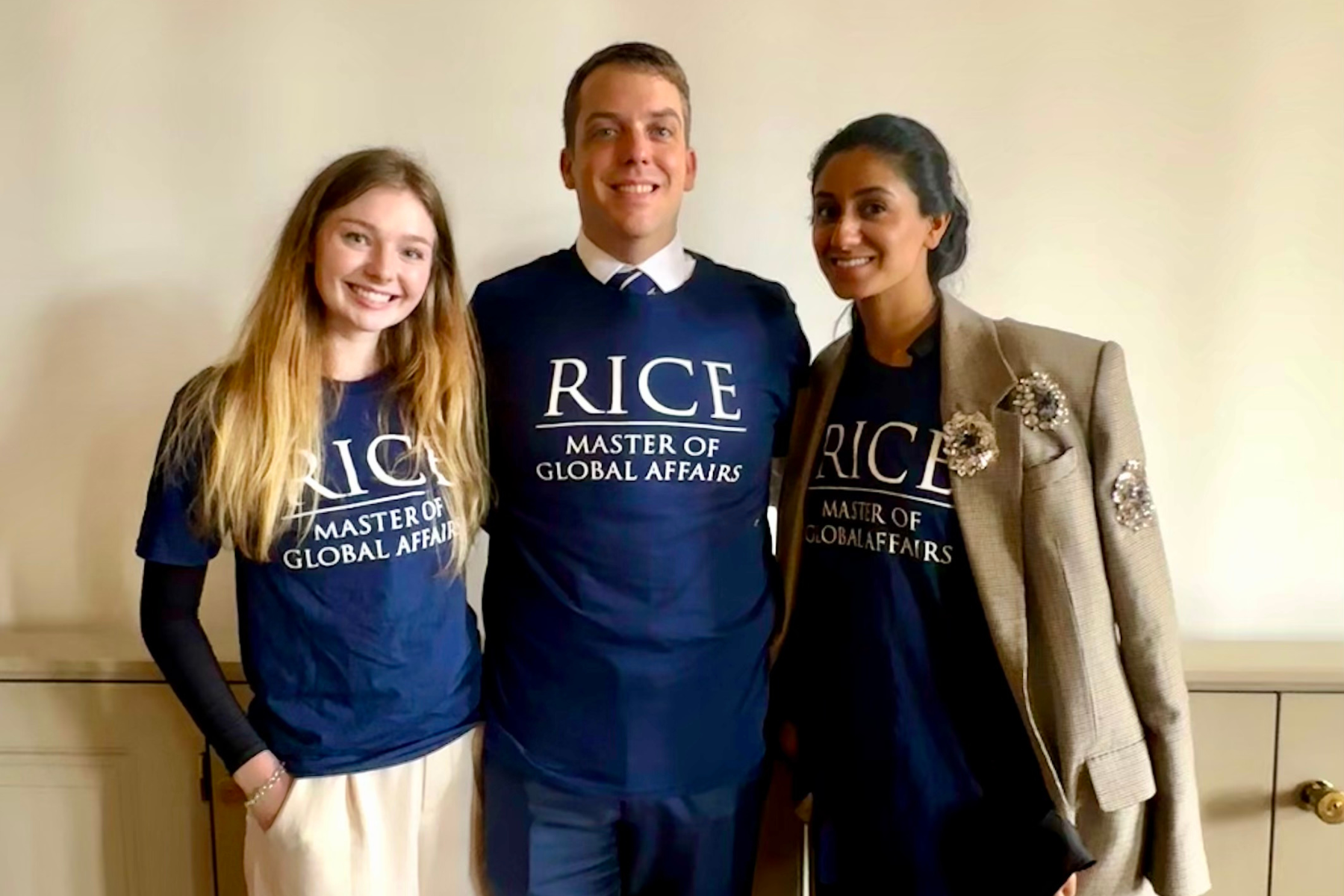 Three students wearing t-shirts that say ''Rice Master of Global Affairs''