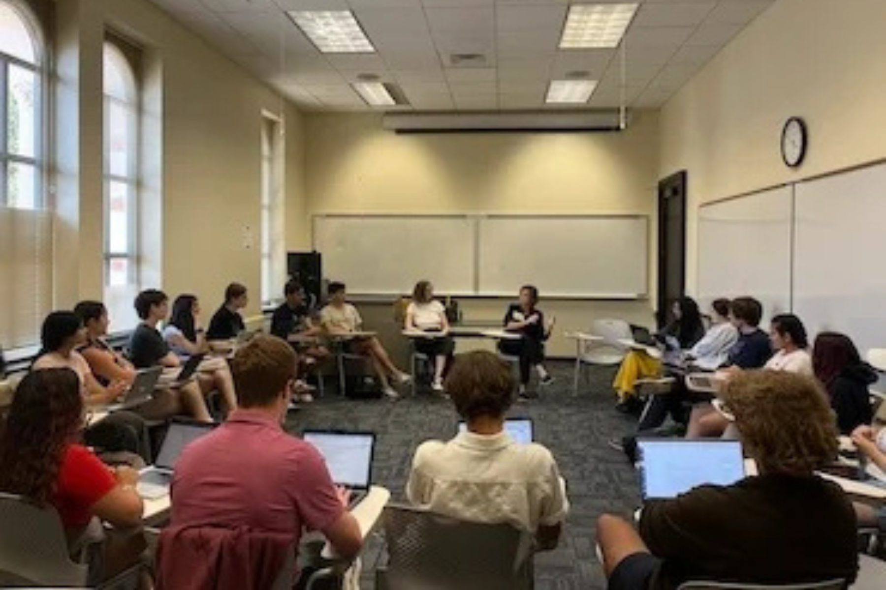 Students sitting in a circle in a classroom